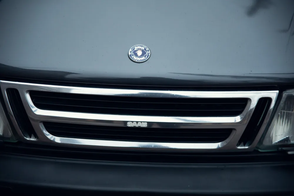 Close-up of a Saab car grille and emblem.