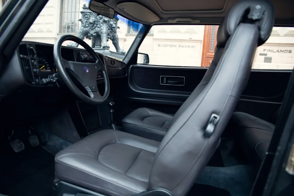 Luxury car interior, leather seats, modern dashboard.