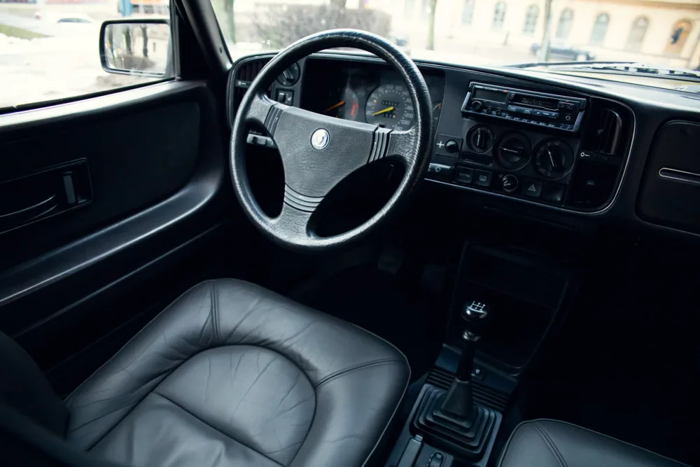 Interior view of a vintage car with manual gearbox.