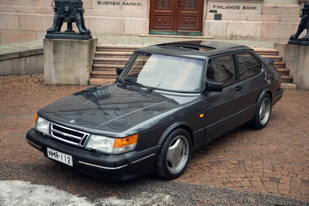 Vintage Saab car parked outside Finland's Bank.