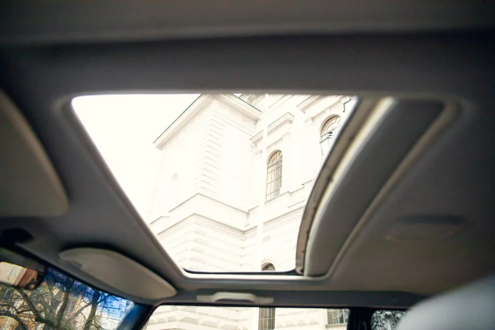 View of a church through car sunroof.