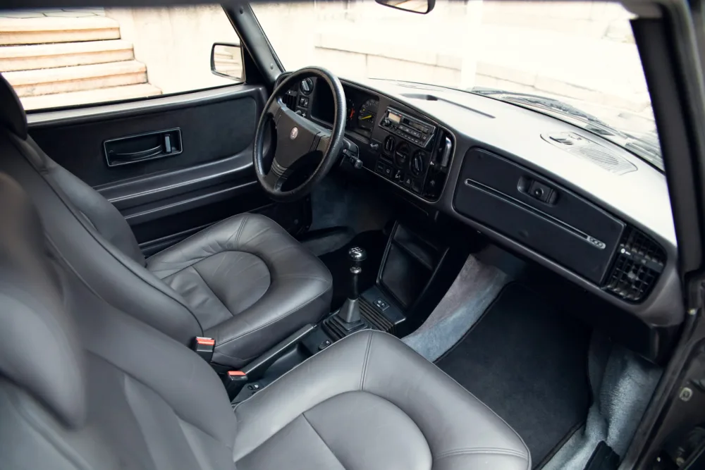 Classic car interior with leather seats and manual transmission