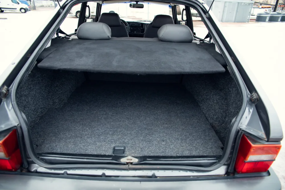 Open hatchback car trunk showing clean empty space.