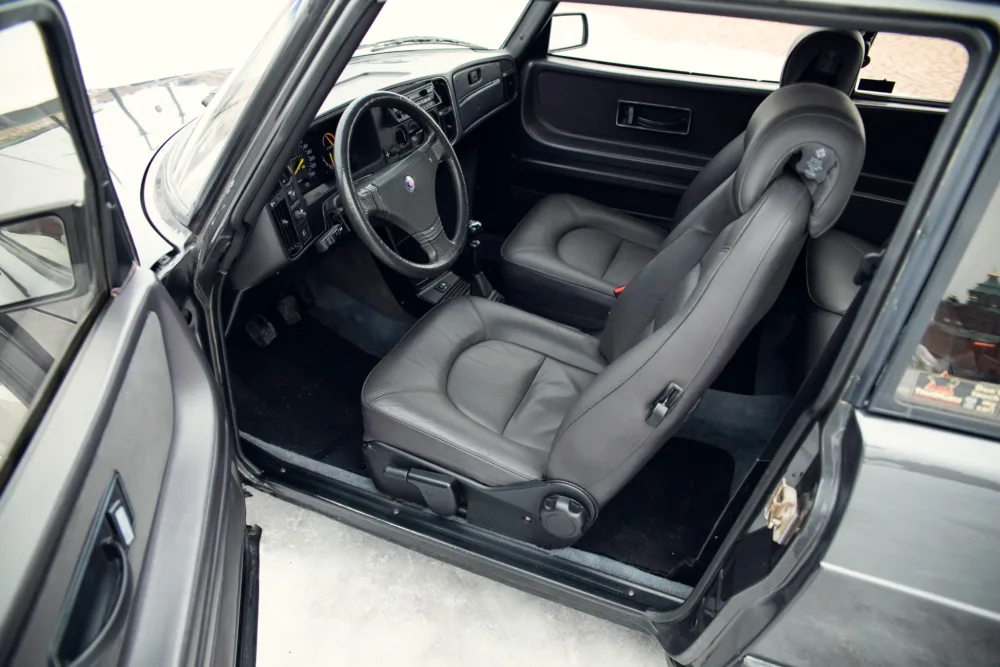 Interior of a gray leather sedan vehicle cabin.