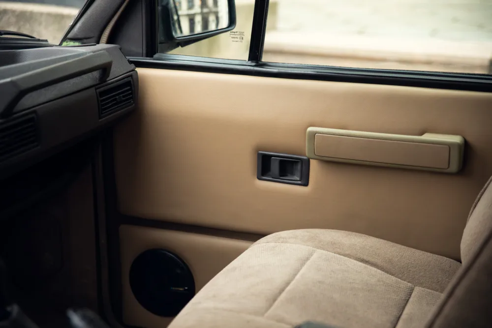 Vintage car interior, door and handle.