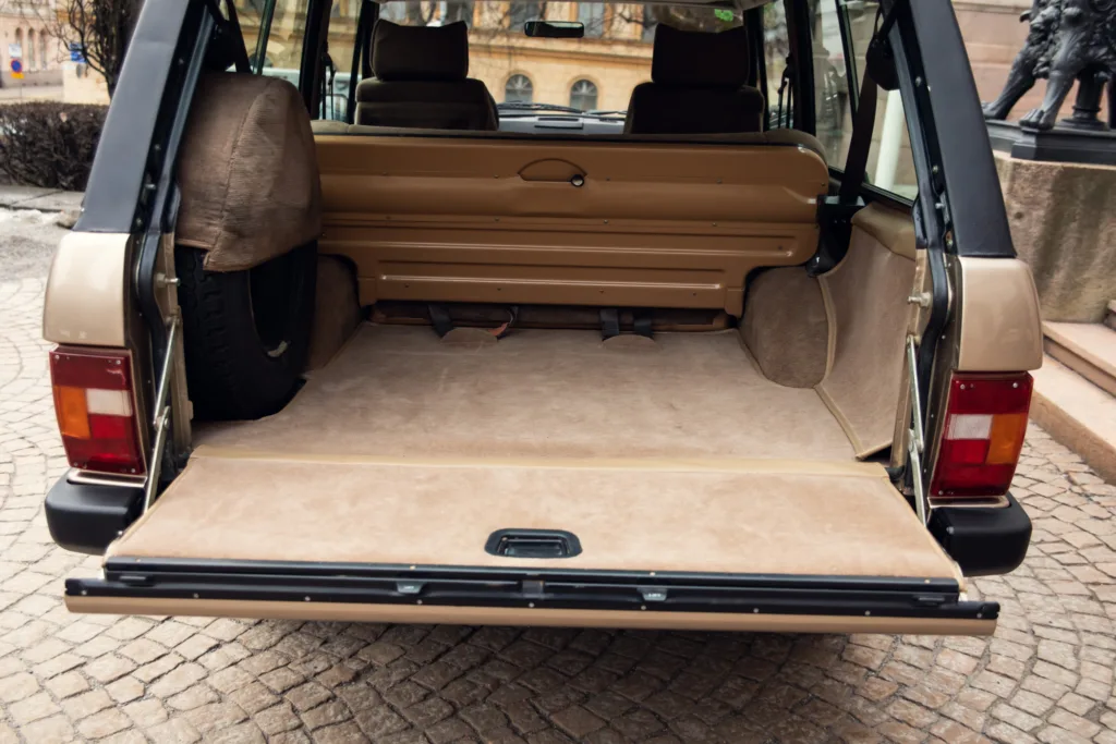 Open trunk of vintage station wagon.