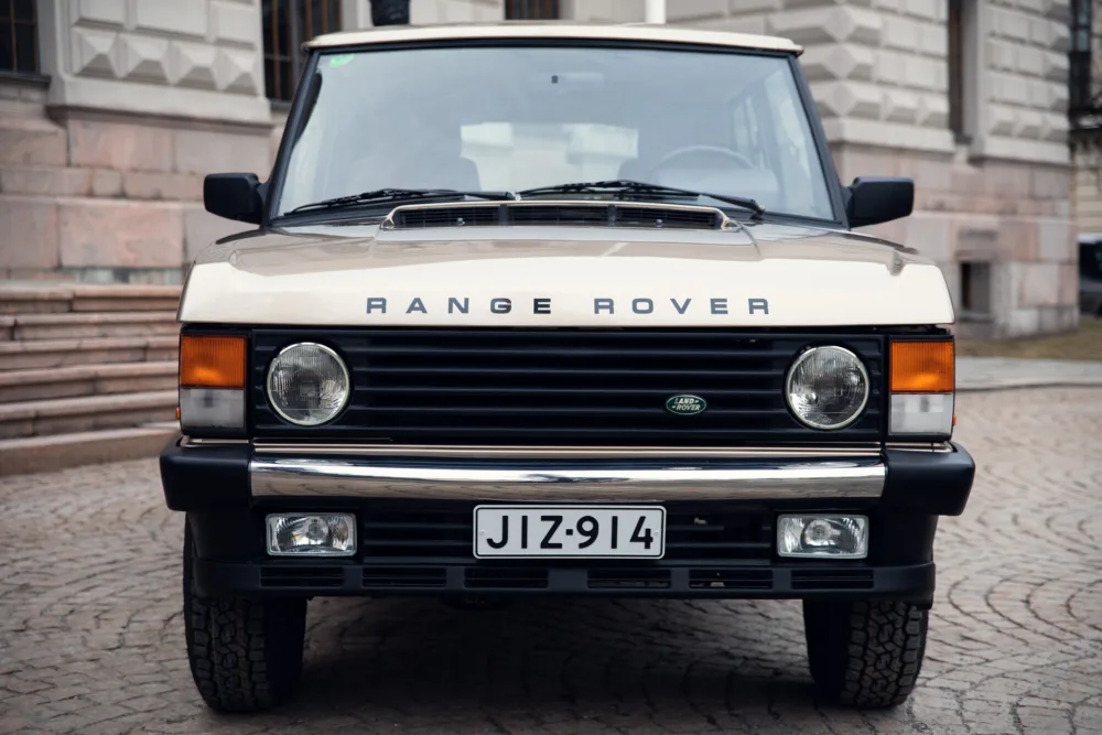 Vintage Range Rover parked on city street