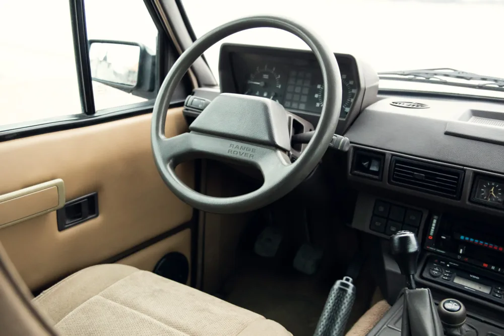 Vintage Range Rover interior dashboard view.