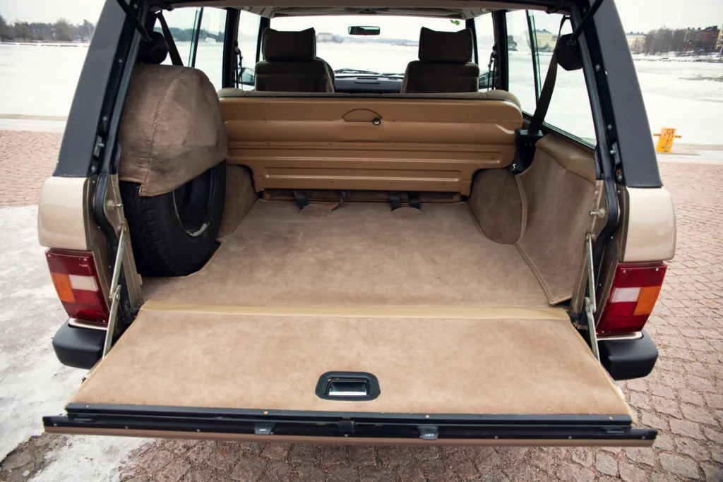 Empty SUV cargo space open hatch.