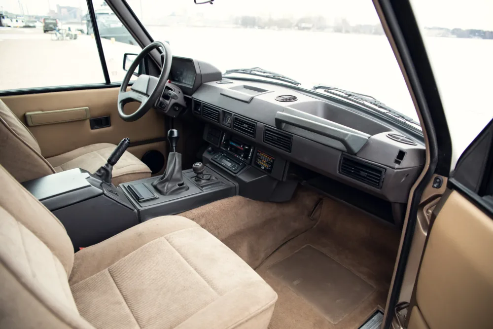 Interior of a vintage car with manual transmission