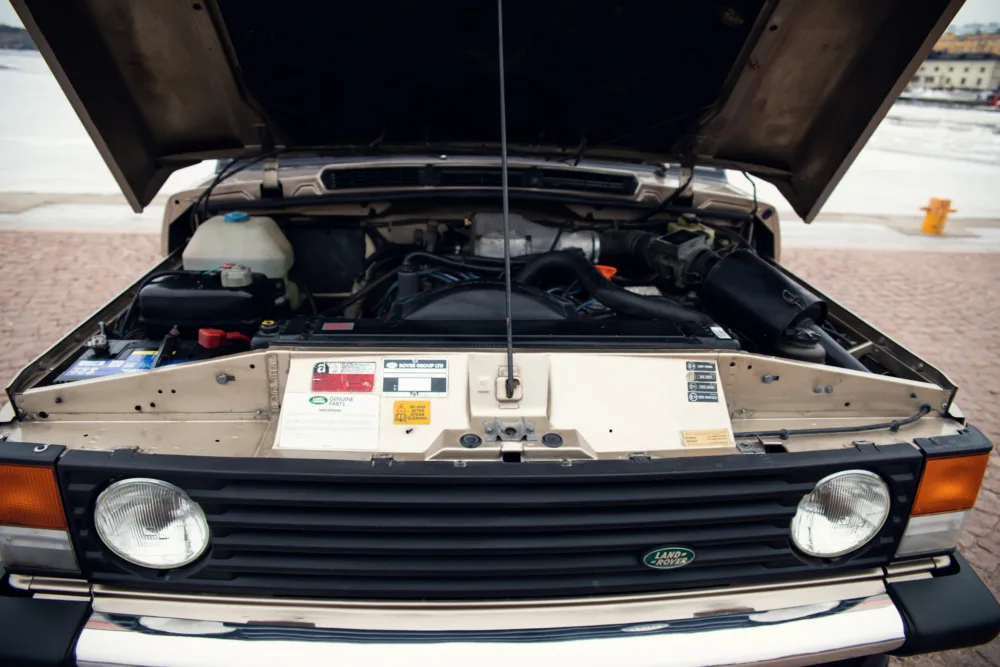 Open hood of a Land Rover showing engine compartment