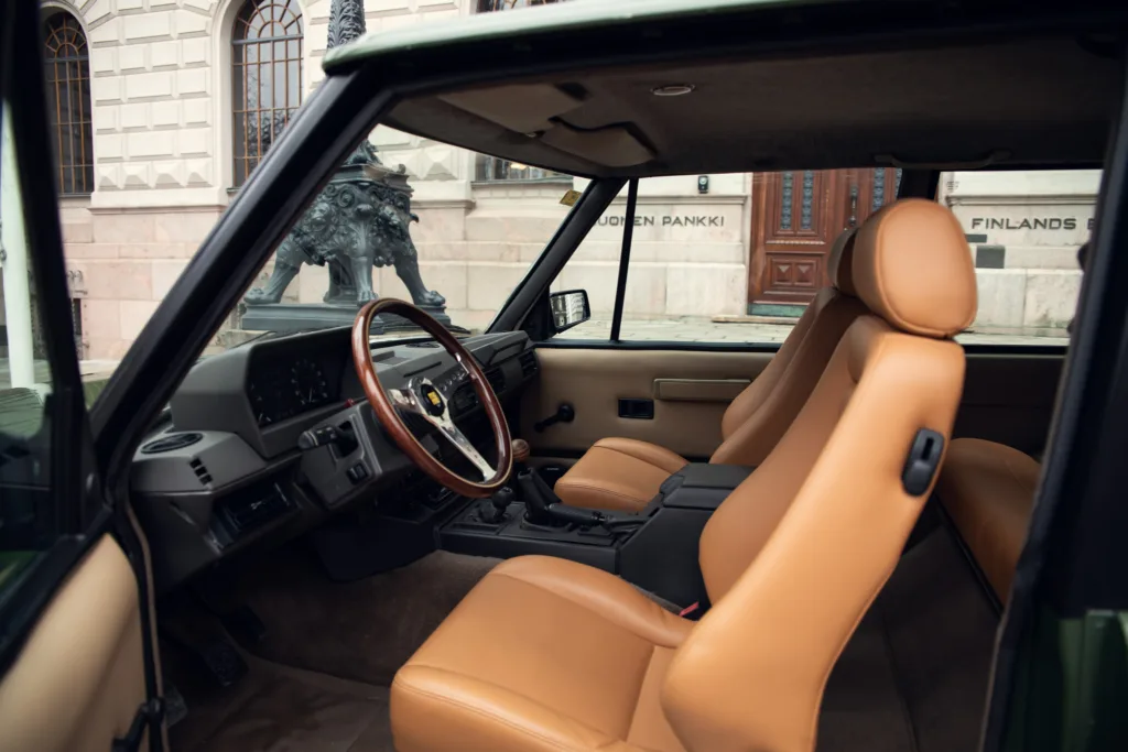 Vintage car interior with tan leather seats.