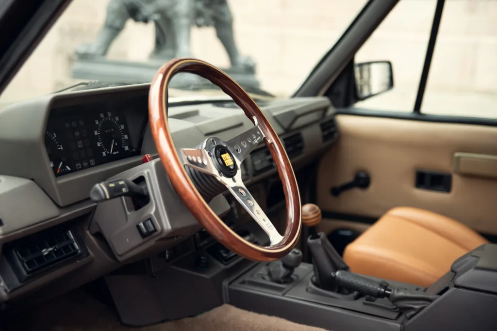 Vintage car interior with wooden steering wheel