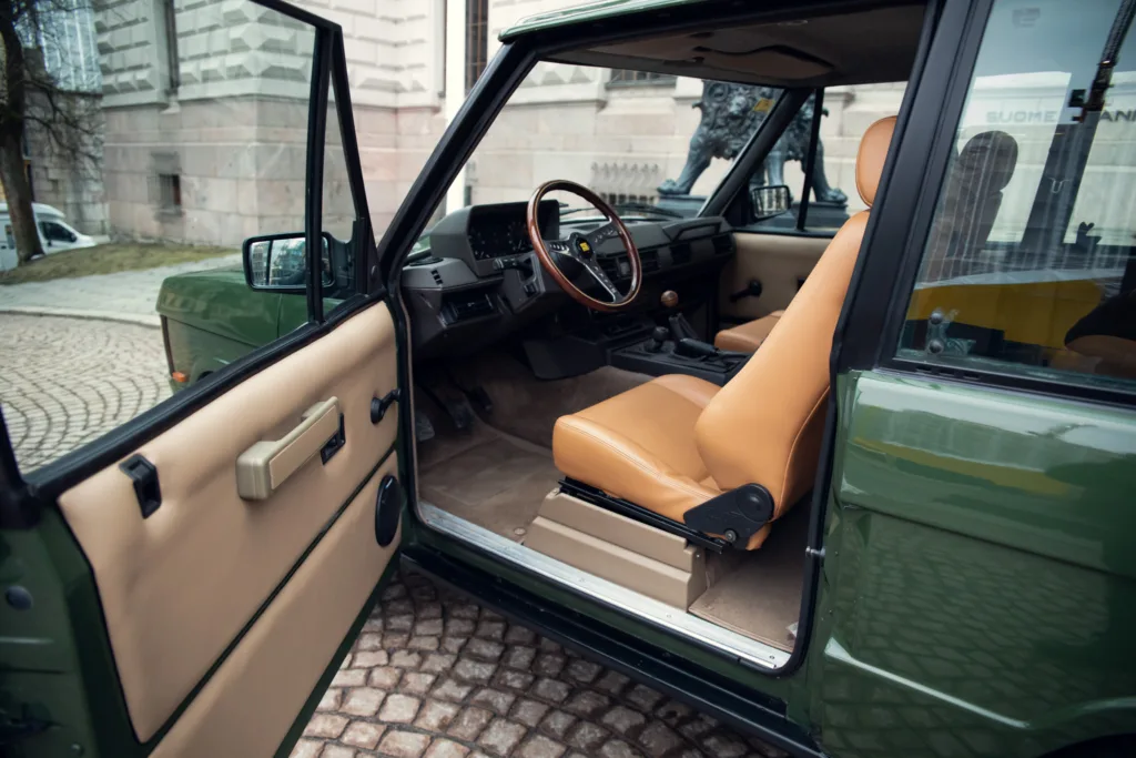 Vintage car interior with tan leather seats.