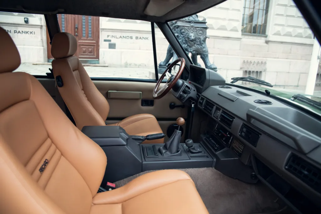 Classic car interior with tan leather seats.