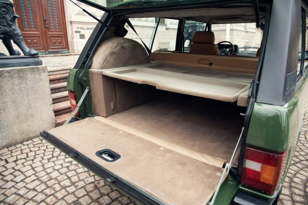Vintage car's open trunk space.
