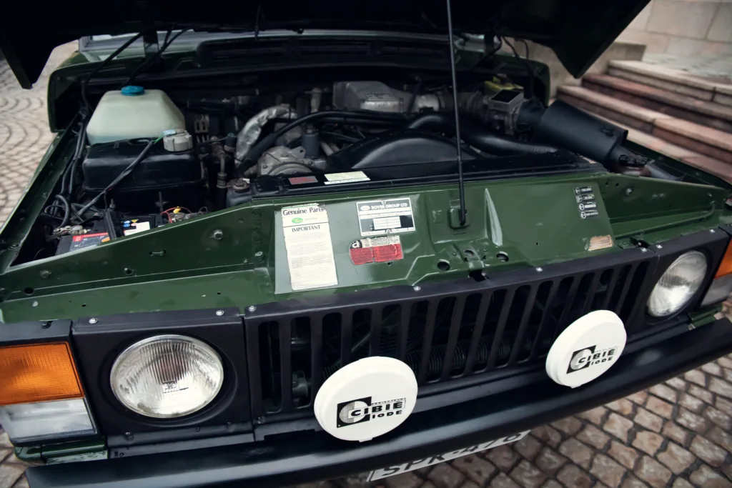 Vintage car engine bay open.