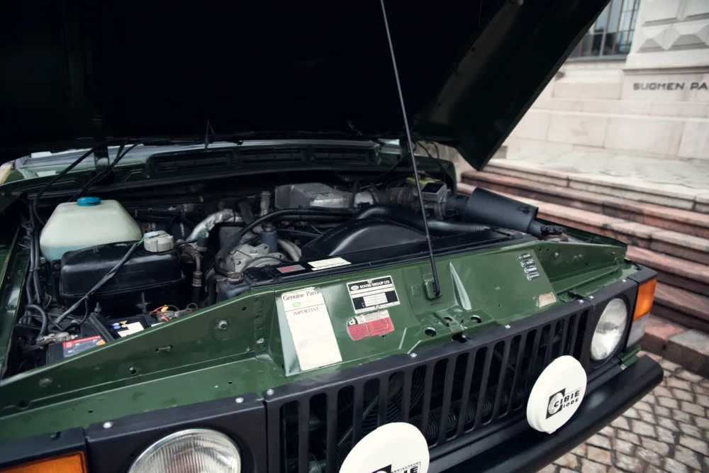 Green jeep engine open hood
