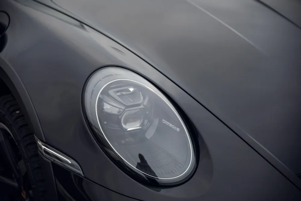 Close-up of a car's headlight design.