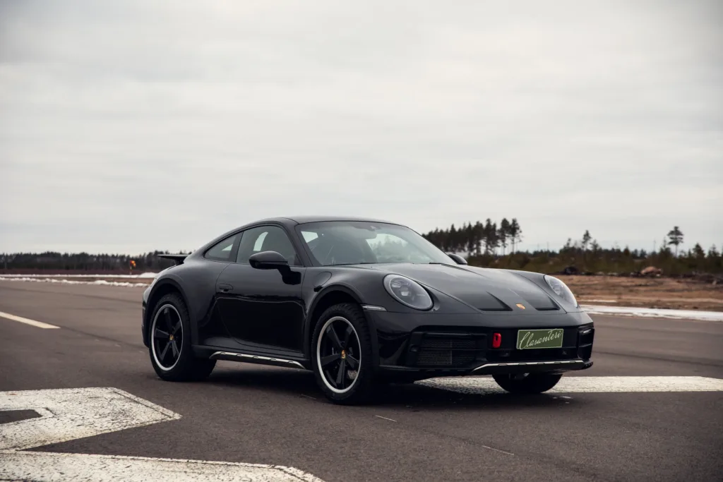 Black sports car parked on airstrip