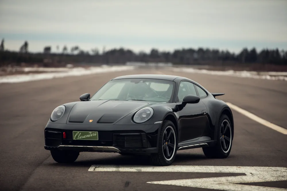 Black Porsche 911 on runway