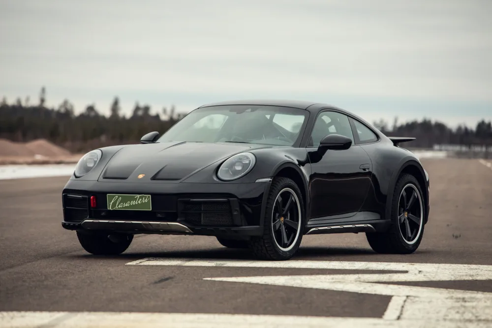 Black Porsche 911 on runway