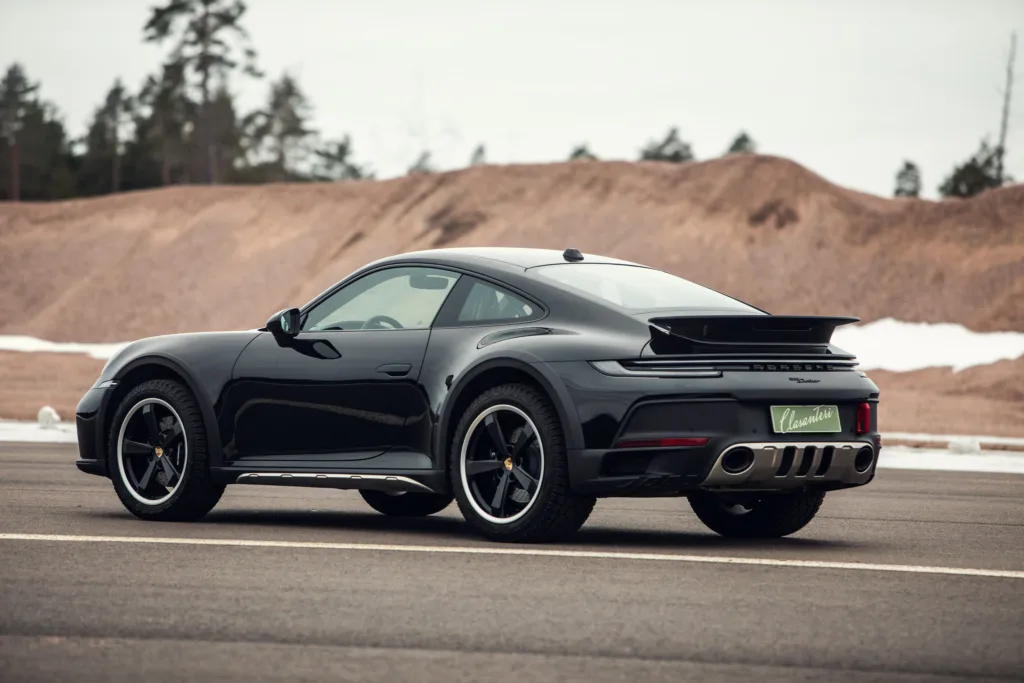 Black sports car parked on roadside