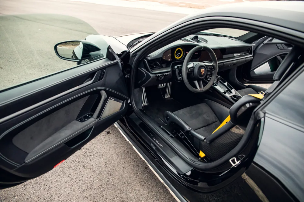Luxury car interior, driver's seat view, modern design.