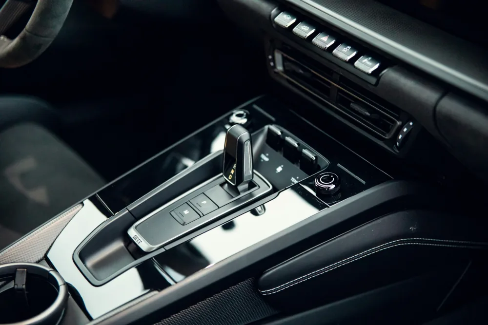 Luxury car automatic gear shifter and console controls.