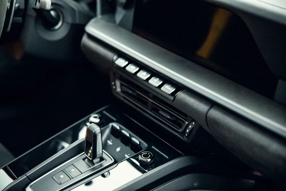 Modern car interior dashboard and gear shift.