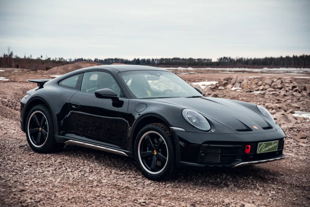 Black sports car on rough terrain