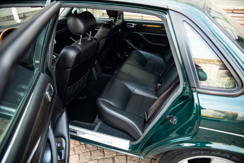 Green car's sleek black leather interior view.