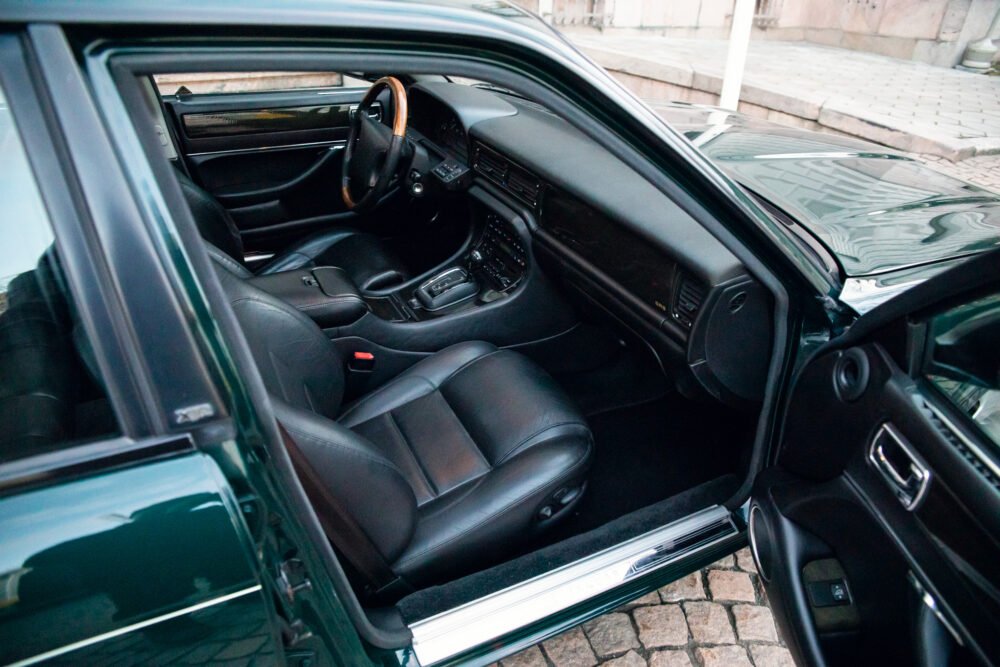 Open door view of a luxury car's interior.