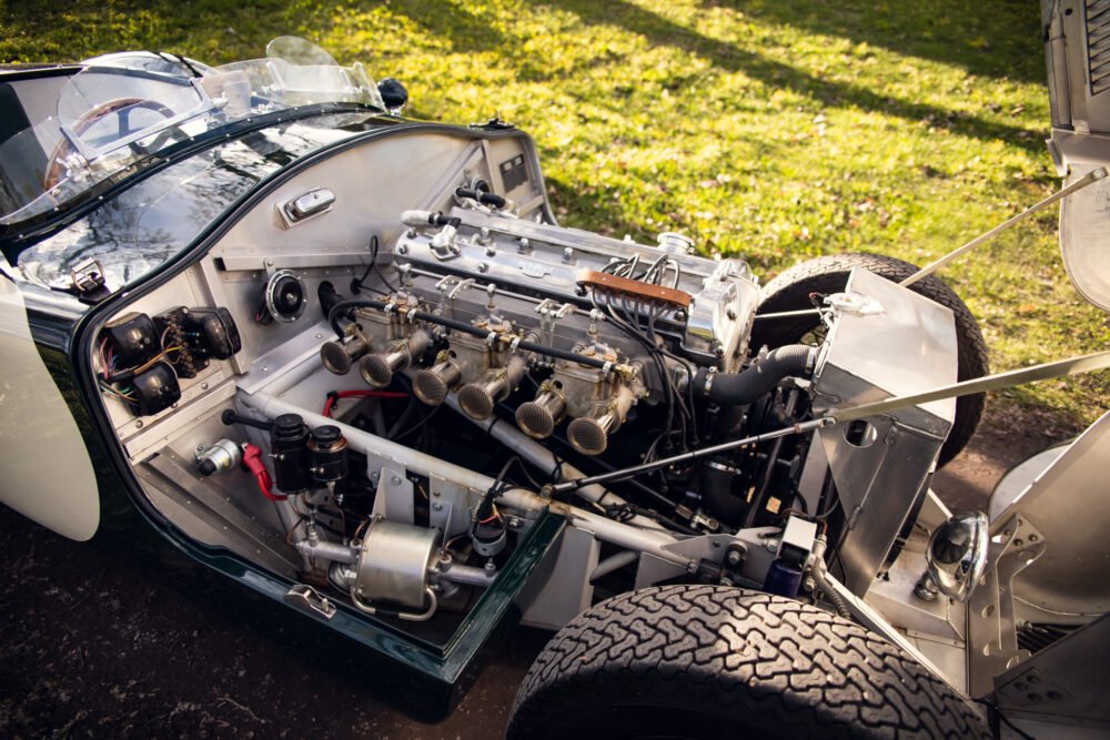 Vintage car engine and open hood detail.
