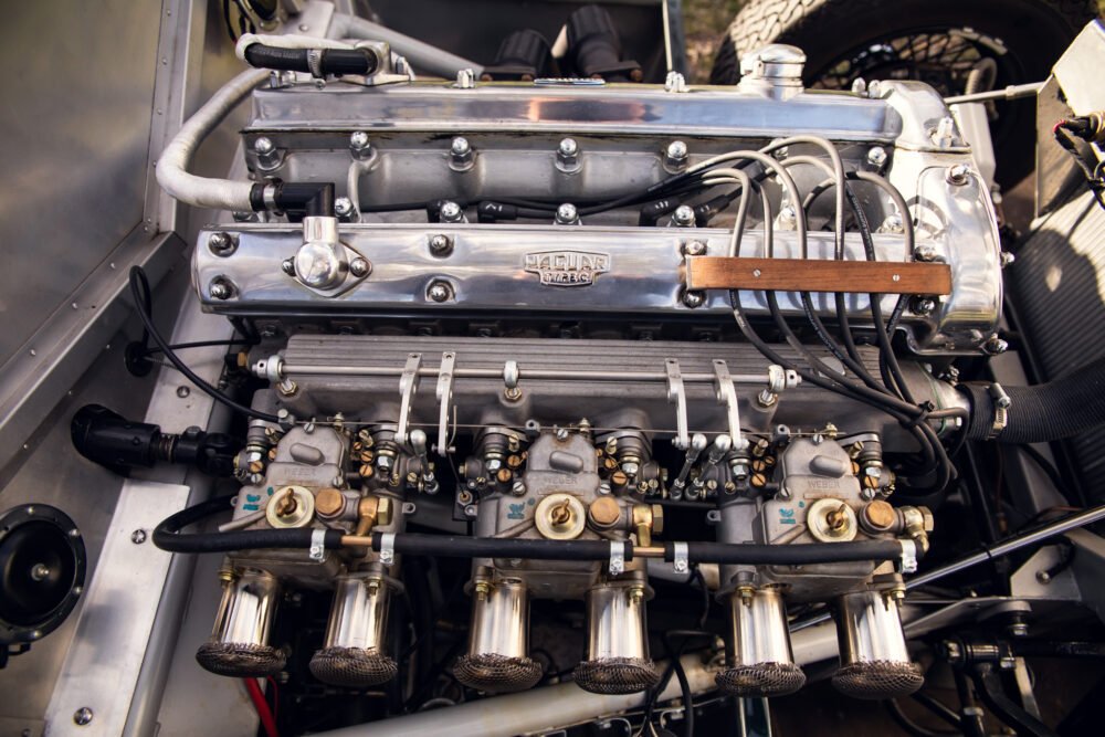 Detailed Jaguar engine showing Weber carburetors.