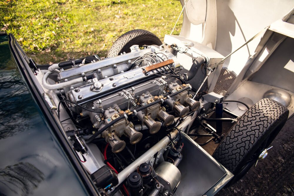 Detailed vintage car engine in open hood.