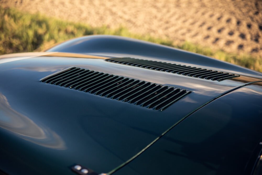 Close-up of vintage car's vented hood.