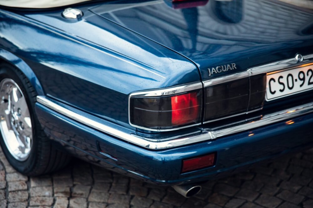 Blue Jaguar car rear view, vintage model.
