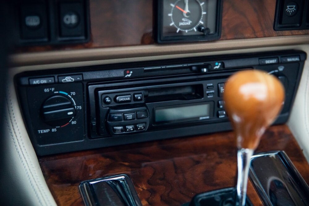 Jaguar car's vintage dashboard with wooden accents.