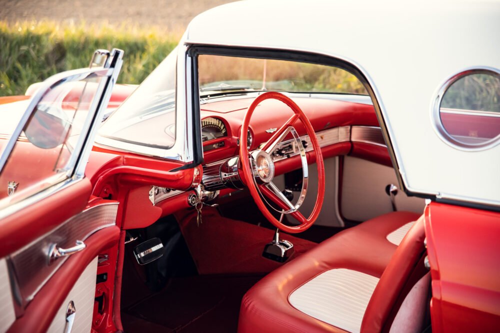 Vintage red convertible car interior view.
