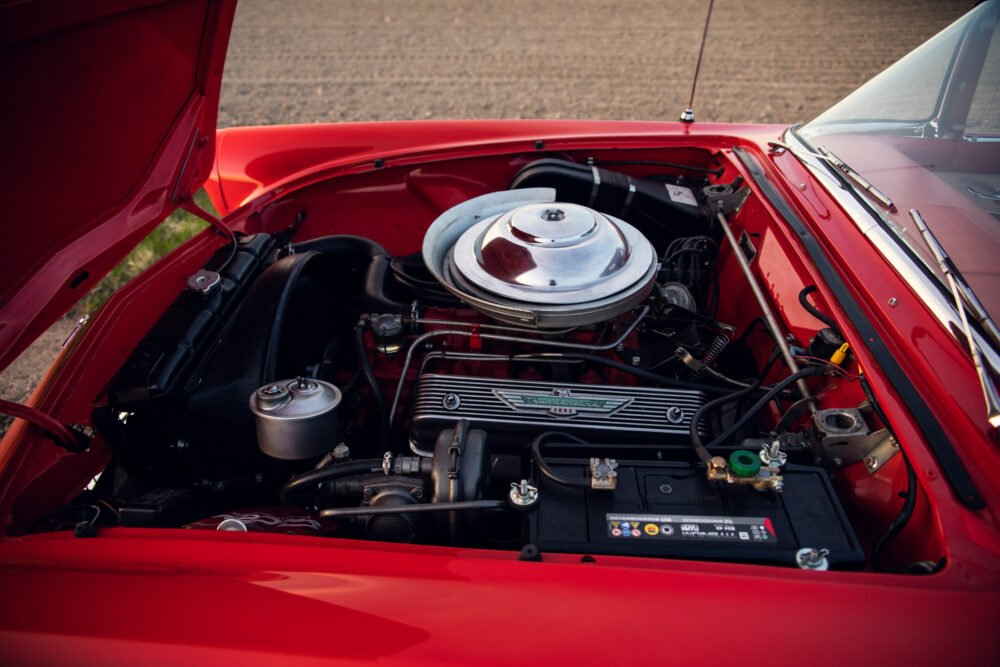Classic red car engine close-up.