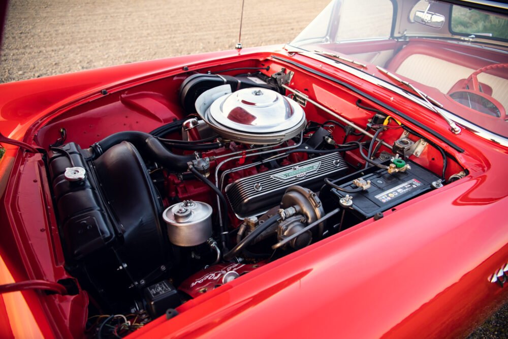 Red vintage car engine detail.