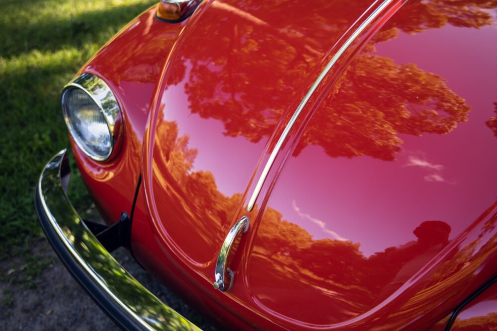 Close-up of vibrant red vintage car.