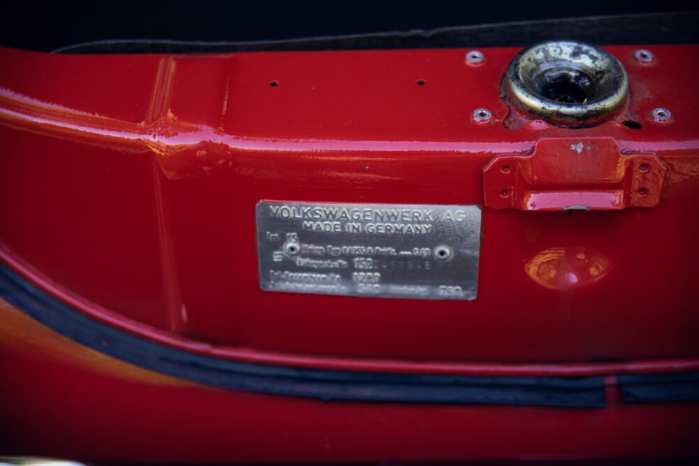 Red Volkswagen vehicle with identification label