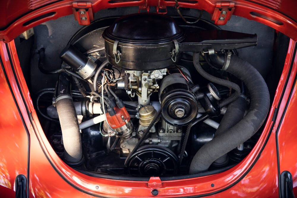 Detailed view of classic red car engine.