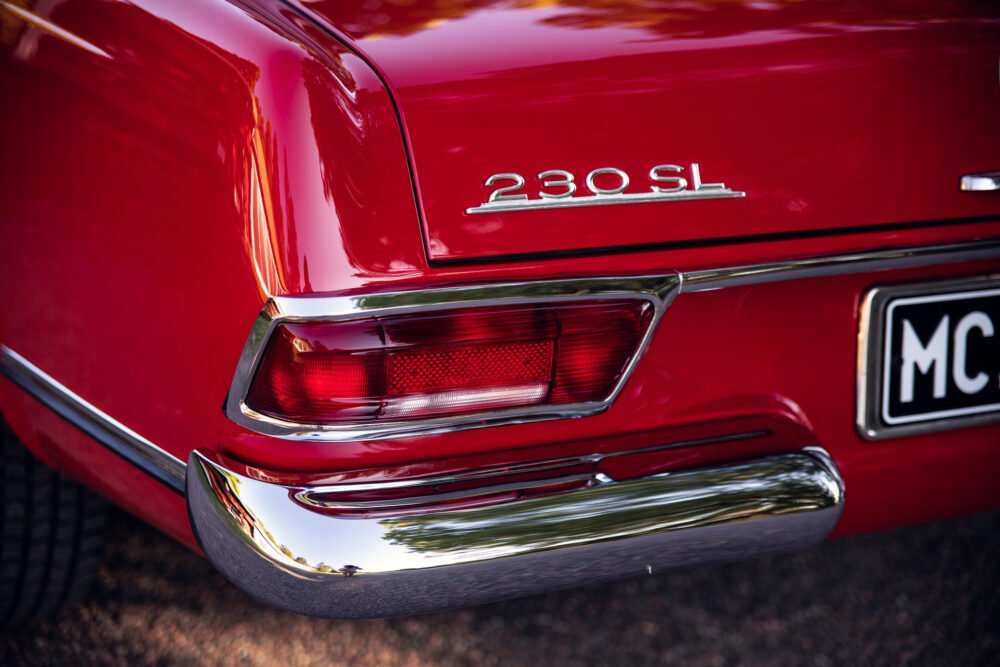 Red 230SL vintage car rear detail view.