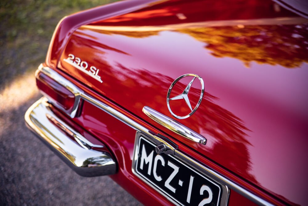 Red Mercedes 230SL, vintage classic car, close-up rear view.