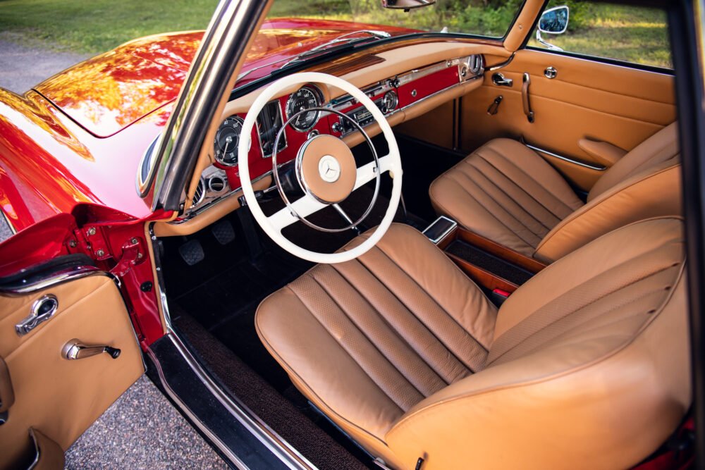 Vintage Mercedes interior with red and tan design.