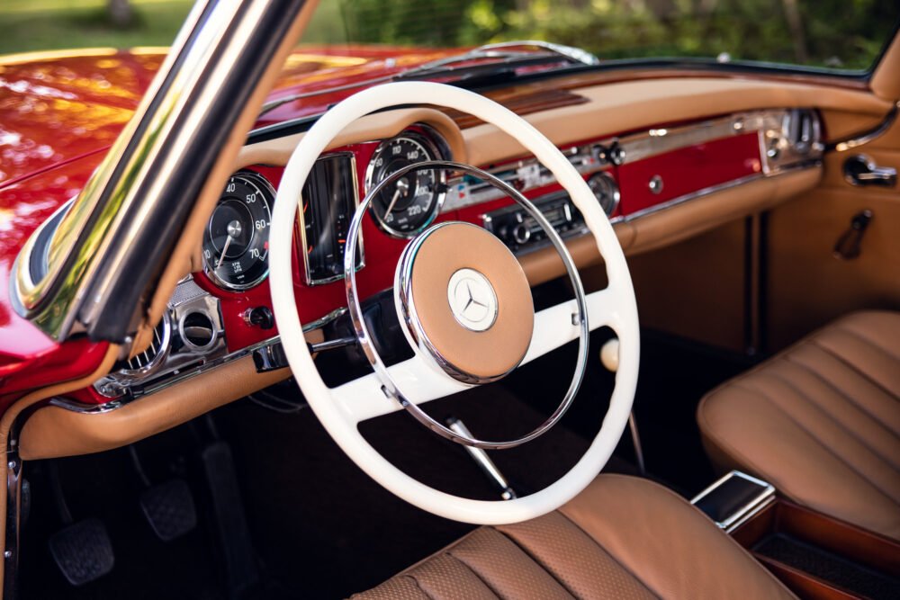 Vintage Mercedes-Benz interior, classic dashboard and steering wheel.