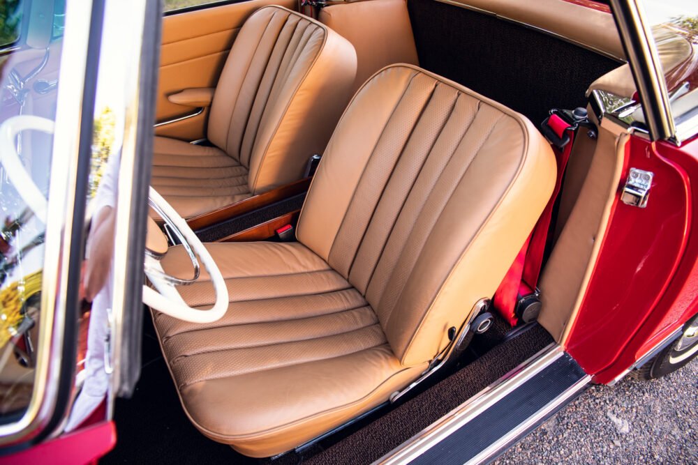 Vintage car with elegant tan leather interior.